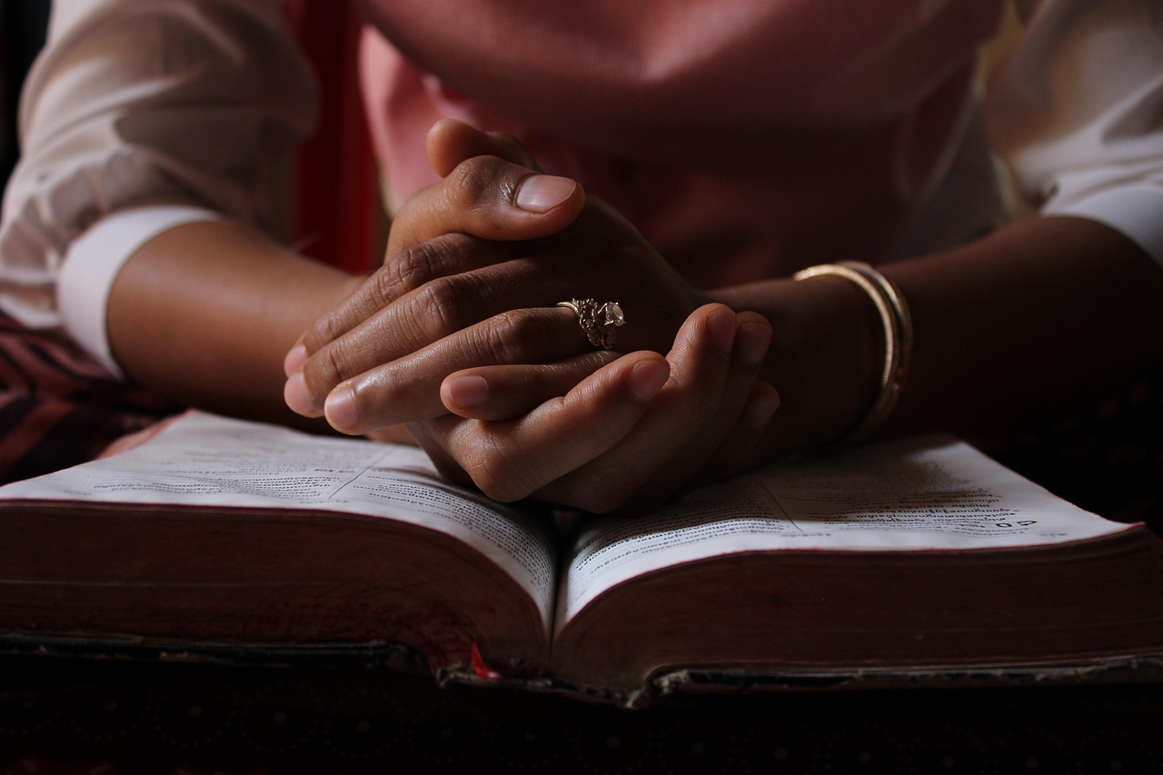 prayer hands bible closeup